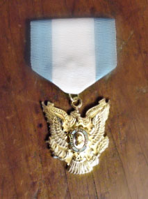 photo of the insignia ribbon and medal of the Daughters of Cincinnati